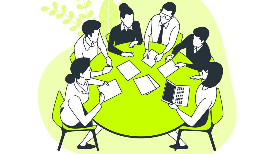 Business professionals in a meeting discussing topics